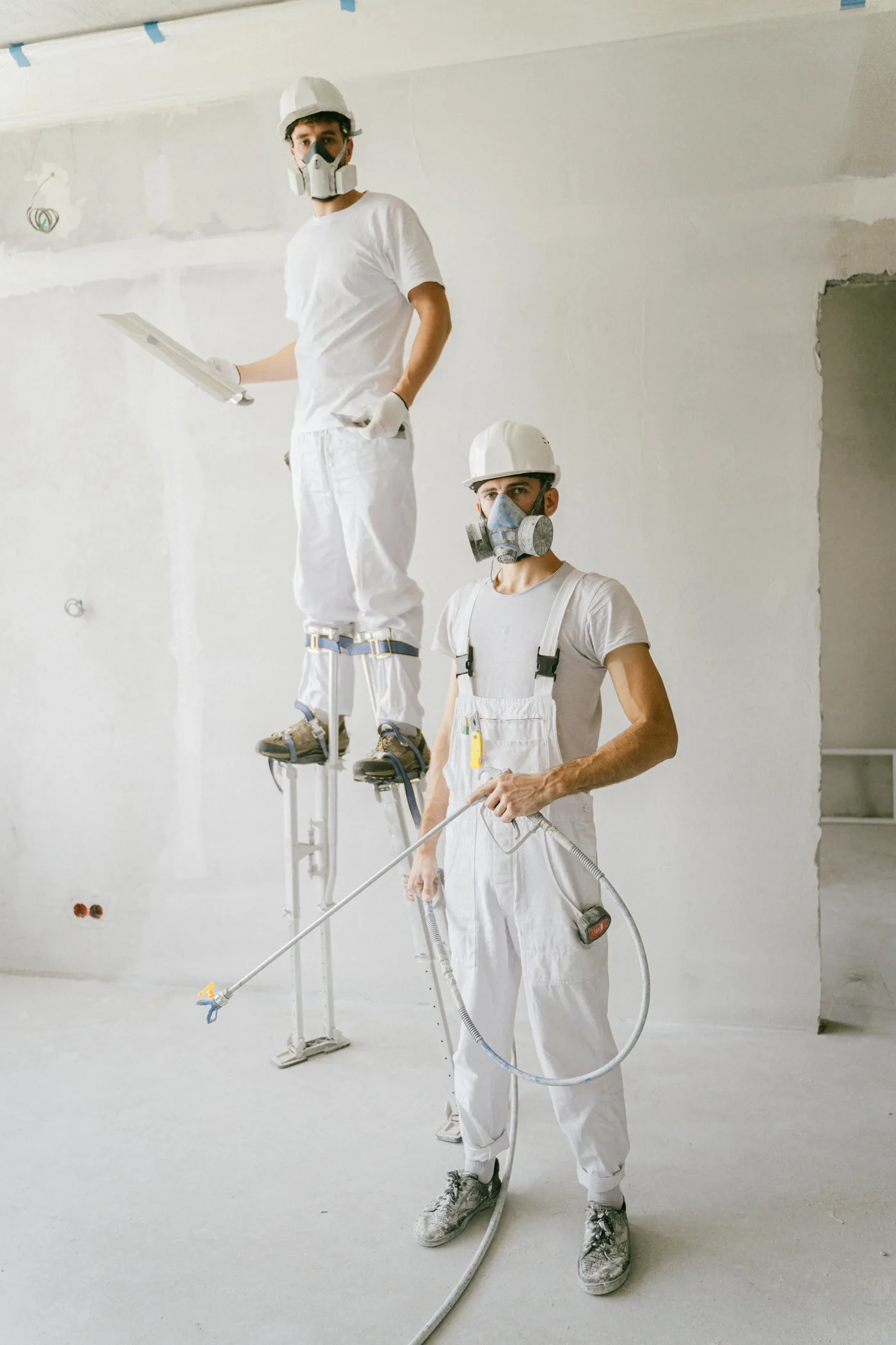water damage restoration boise idaho — technician extracting water from flooded living room