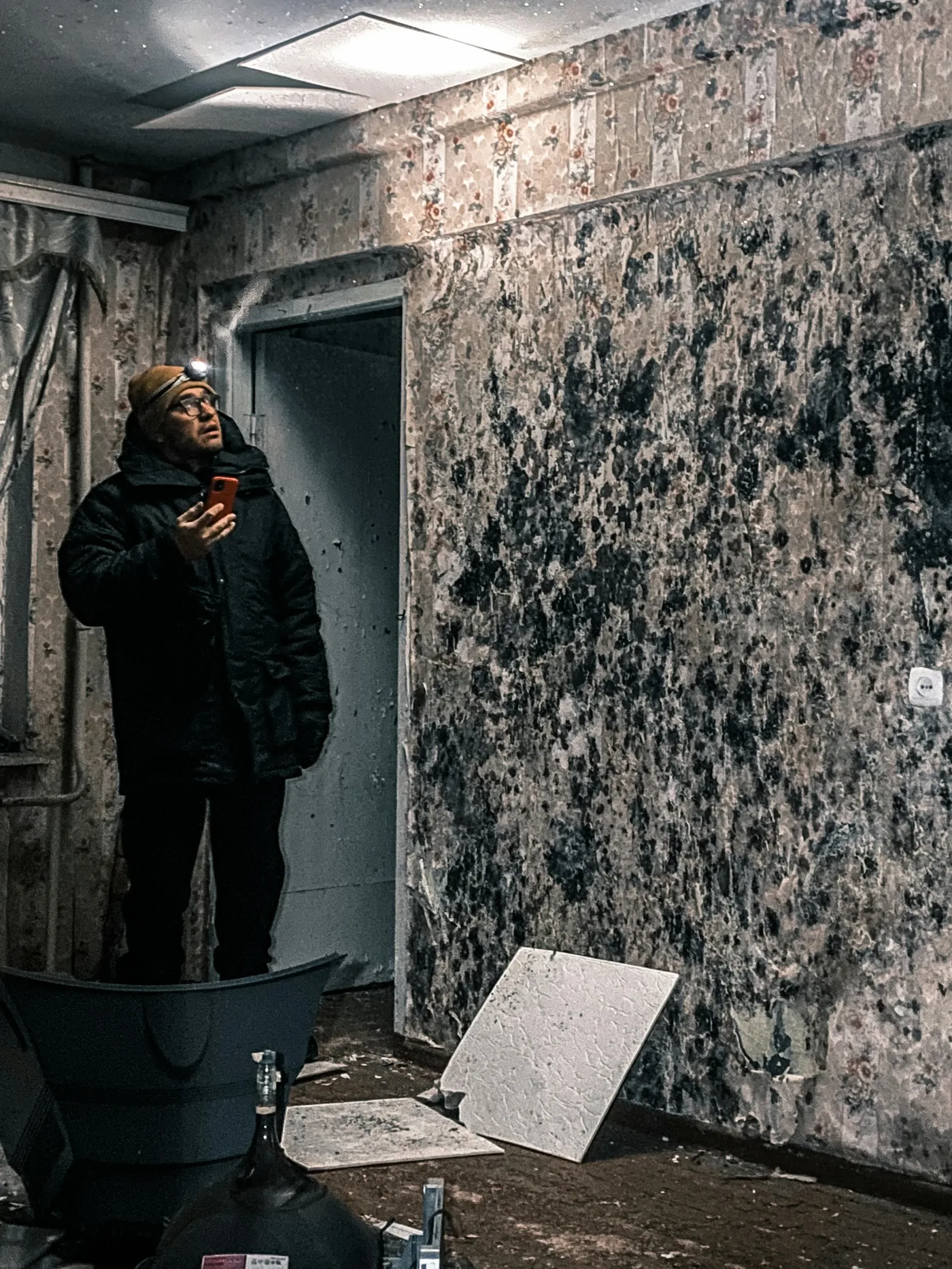 mold remediation boise idaho — technician in full protective gear treating mold